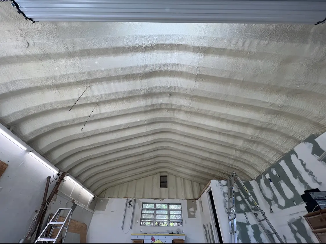 Spray polyurethane foam applied to the underside of a metal roof deck in Fridley